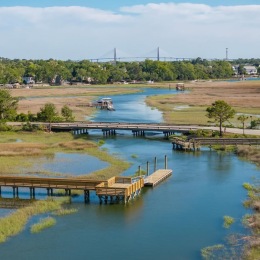 a view of a marsh and community dock
