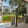 Courtyard townhomes surround a central green with grand oaks